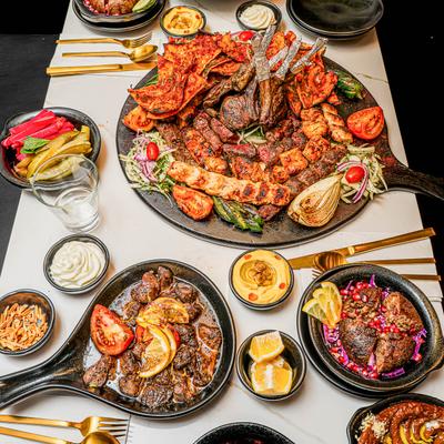 Assortment of food dishes spread on a table, top view.