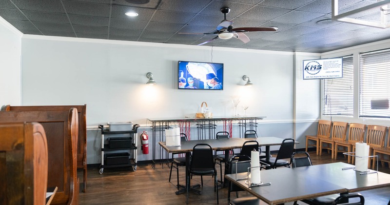 Interior, tables and seats, TV on the wall