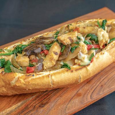 Chicken sub with spinach, garlic, mushrooms, onions, grilled peppers, and provolone.