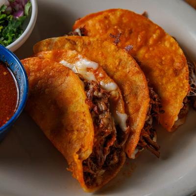 Pulled beef and cheese tacos, closeup