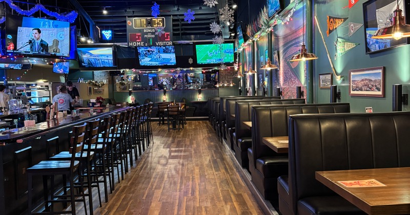 Interior with a mix of booth and counter seating and various decorations