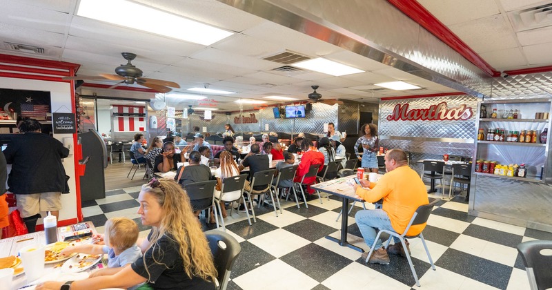 Interior, dining area, customers eating and drinking