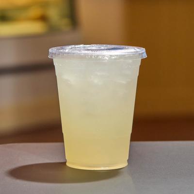 A sealed cup of lemonade.