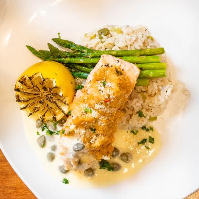 Crab Stuffed Salmon, asparagus, charred lemon, rice