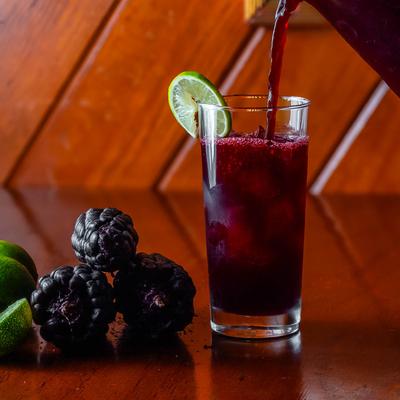 A glass of Chicha Morada, Peruvian purple corn beverage.