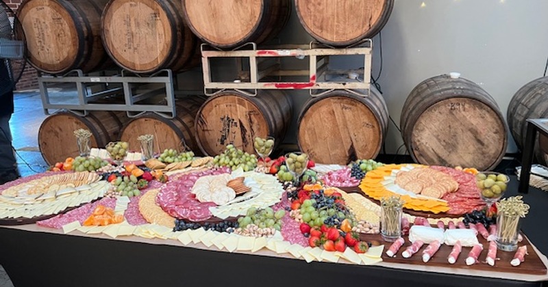 grazing table full of as assortment of fruits and vegetables