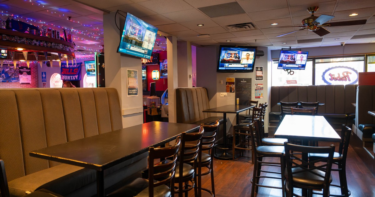 Seating area with TV screens on the walls