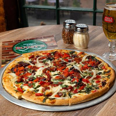 Mediterranean pizza, with beer on the side