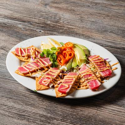 Ahi Tuna on tostada chips  with cabbage, avocado, fresh jalapenos, cilantro.