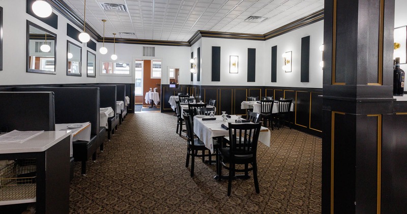 Interior, spacious seating area with tables and chairs