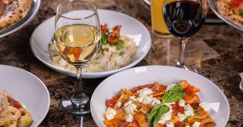 Different dishes served with white and red wine