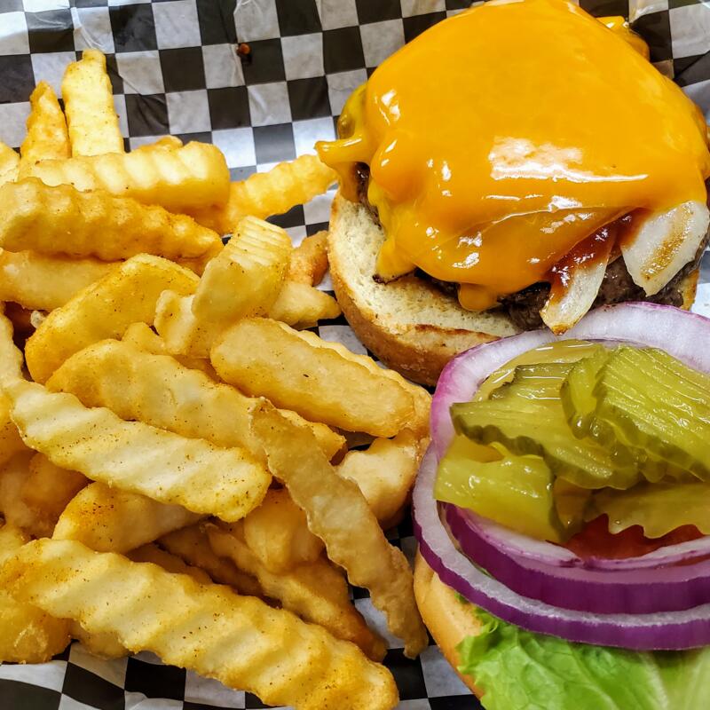 BBQ Sauteed Onion & Cheddar Burger* photo