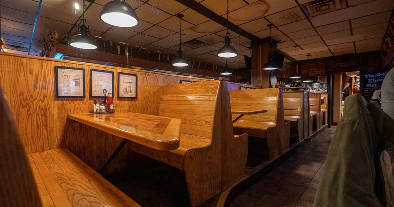 Interior, wooden booths with bar in the back