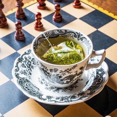 Green tea on a chessboard.