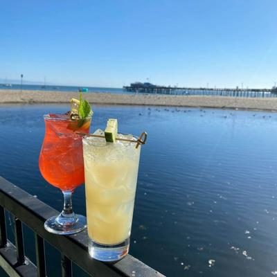 Cocktails on the railing over the water.