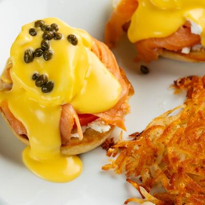 Smoked salmon eggs benedict with hush browns.
