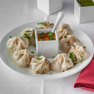 Chicken Steamed Momo dumplings served with house chutney.