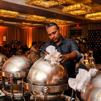 Chef handling the heating trays