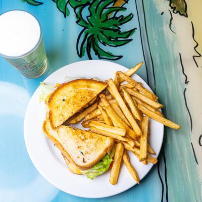 Cheeseburger in sourdough bread, with fries.