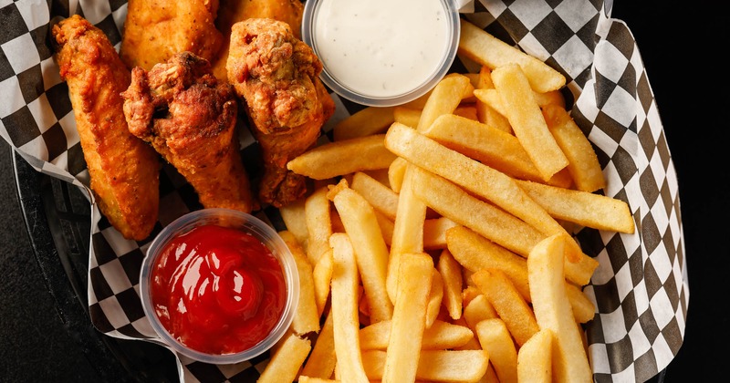 Original Wings served with fries, ketchup and a sauce, overhead view