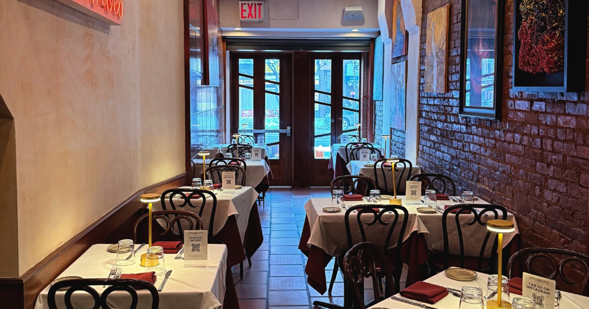 Dining room with set tables overlooking the entrance area