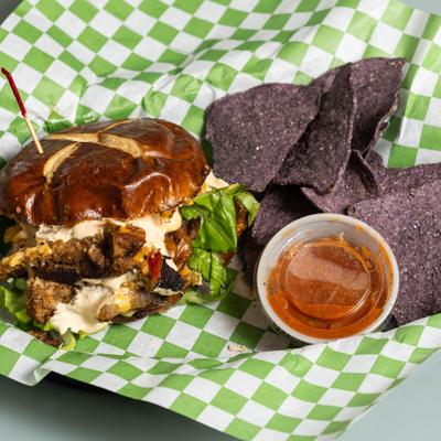 Philly Fake Steak served with tortilla chips and a dipping sauce.