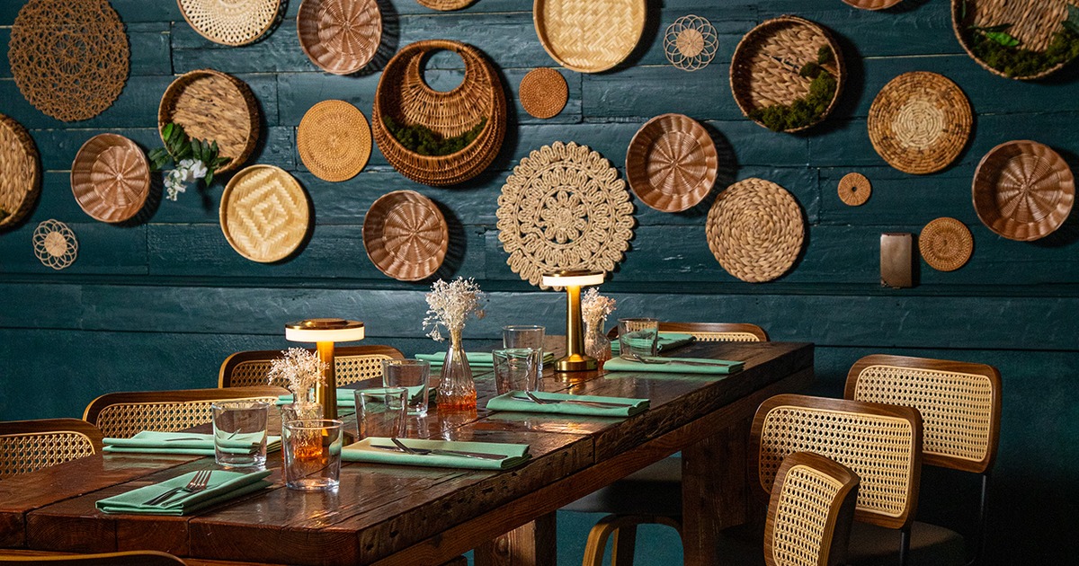 Table set for eight guests, close up, wall decoration