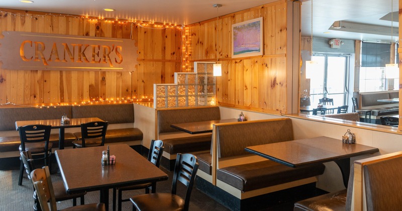 Interior, seating area with booths, tables and chairs