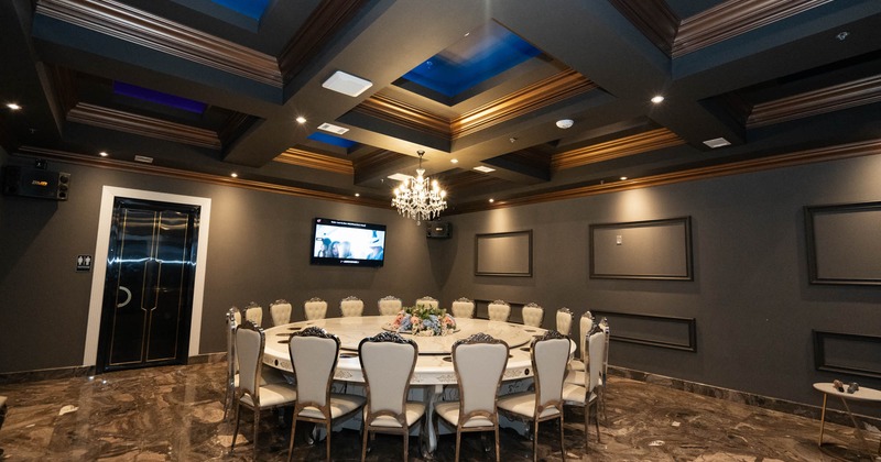 Bar area with a large TV screen on the wall