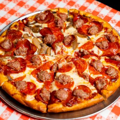 A pizza with meat toppings.