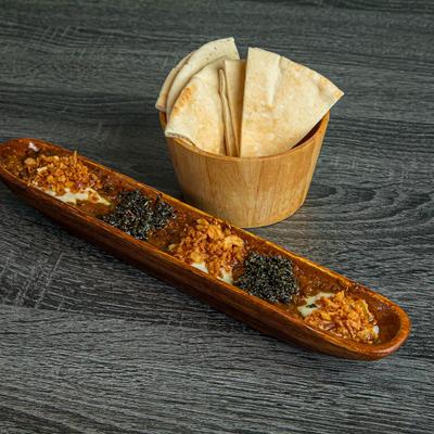 Fried eggplant, touch of garlic with topping of whey.