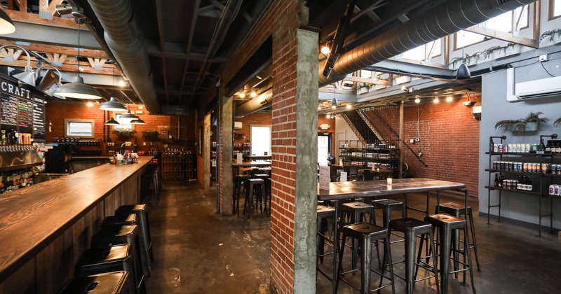 Bar area, high tables, and stools