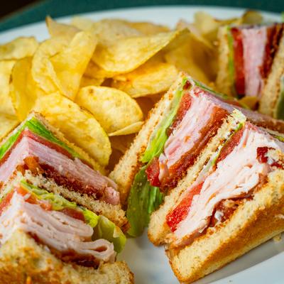 Club sandwich and potato chips.