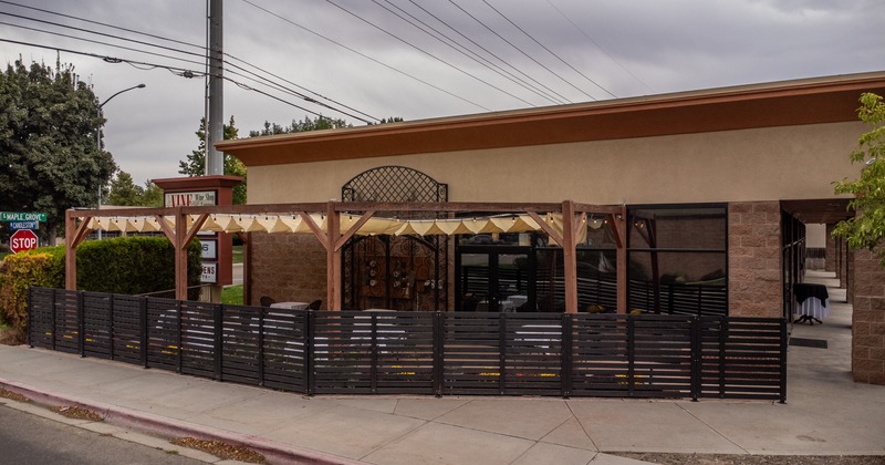 Exterior, angle view to side walk terrace, entrance