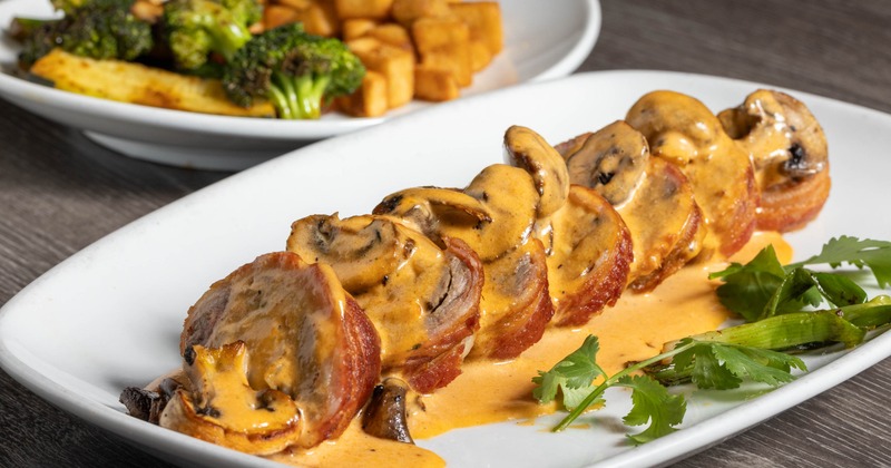 Angus Steak stuffed with shrimp then wrapped in bacon, smothered in ranchero sauce