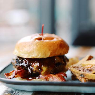 Barbecue bacon cheeseburger with fries.