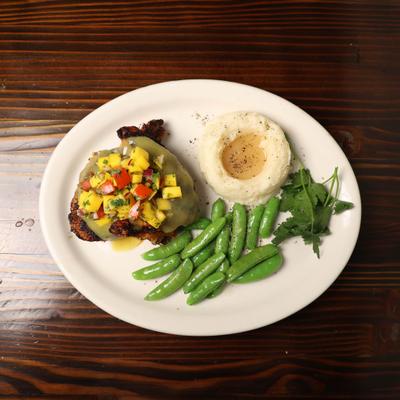 Filet Mignon with mango salsa, snap peas, and mashed potatoes.