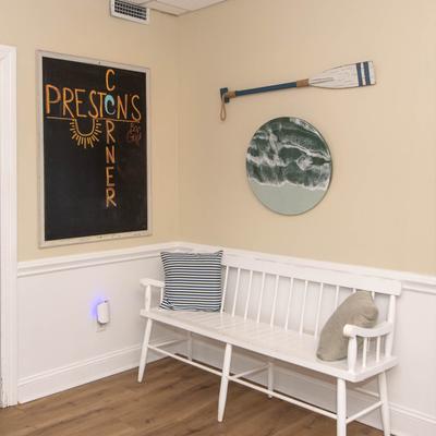 White bench with pillows.