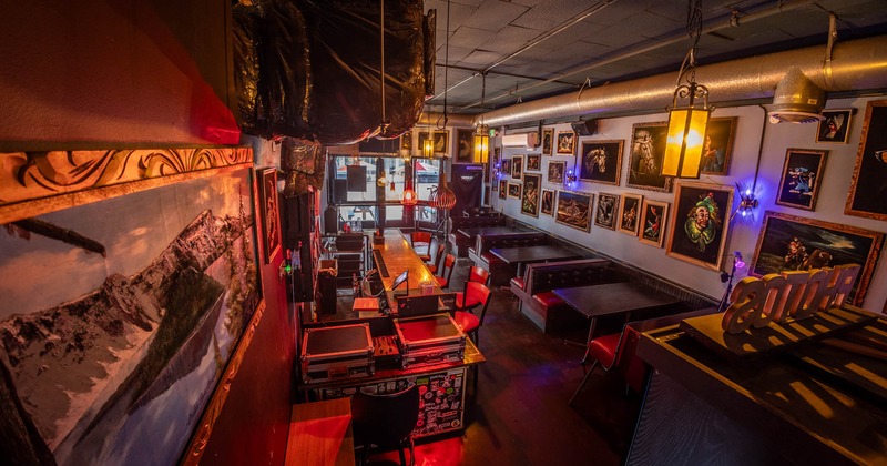 Interior, seating area with a bar, tables and chairs