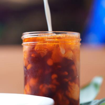 Milk being toured wint a jar with Thai Iced Tea.