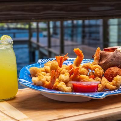 A served meal and a drink.