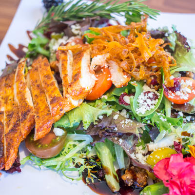 Grilled chicken and salad greens.