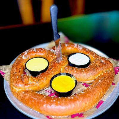 NPL Gigantic Pretzel served with honey mustard, ranch and cheese sauce.