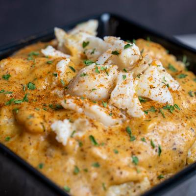 Cajun Crab Grits. Creamy Cajun crab grits topped with Cajun cream sauce and lump crab meat..