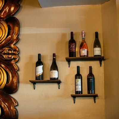 Wine bottles on the shelves.