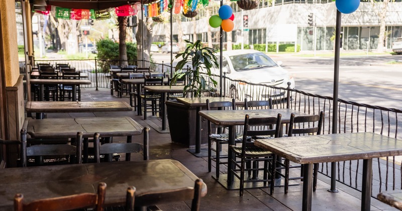 Outdoor restaurant patio with tables and chairs