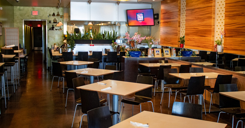 Restaurant's interior with guest tables and chairs