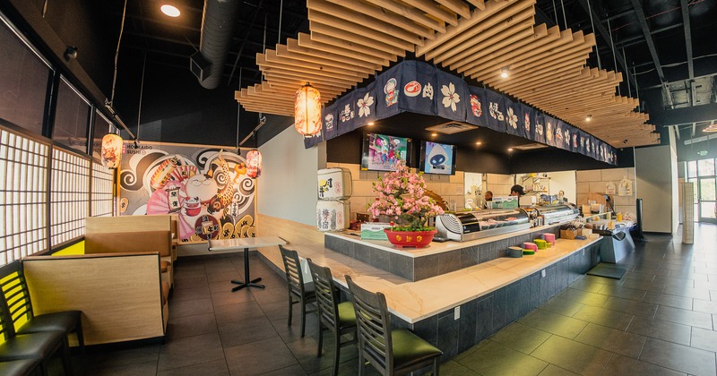 Sushi restaurant interior space, dining area with central sushi bar