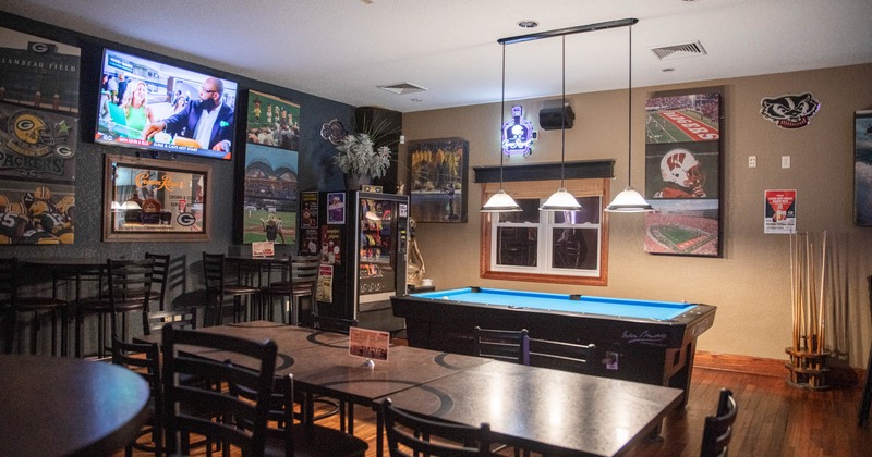 Interior, party room, seating area, pool table, Packers pictures, TV, vending machine