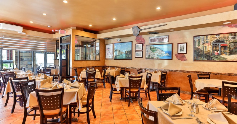 Interior, chairs and tables ready for guests, restaurant entrance, shop window